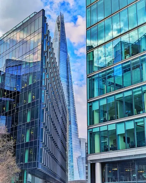 Glass skyscrapers london clouds