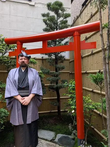 Alec in kimono at Torii gate in Japan